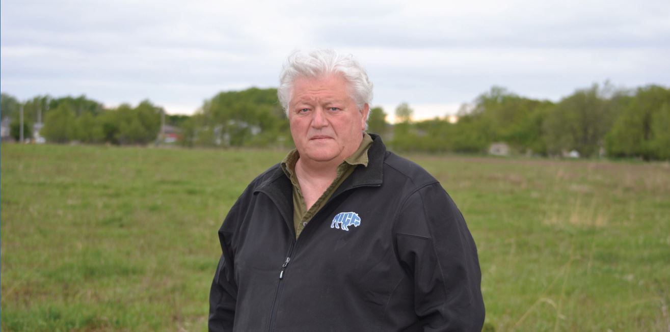 Hank Miller in Santee's garden and prairie outdoor space. This area is part of varying projects and research.